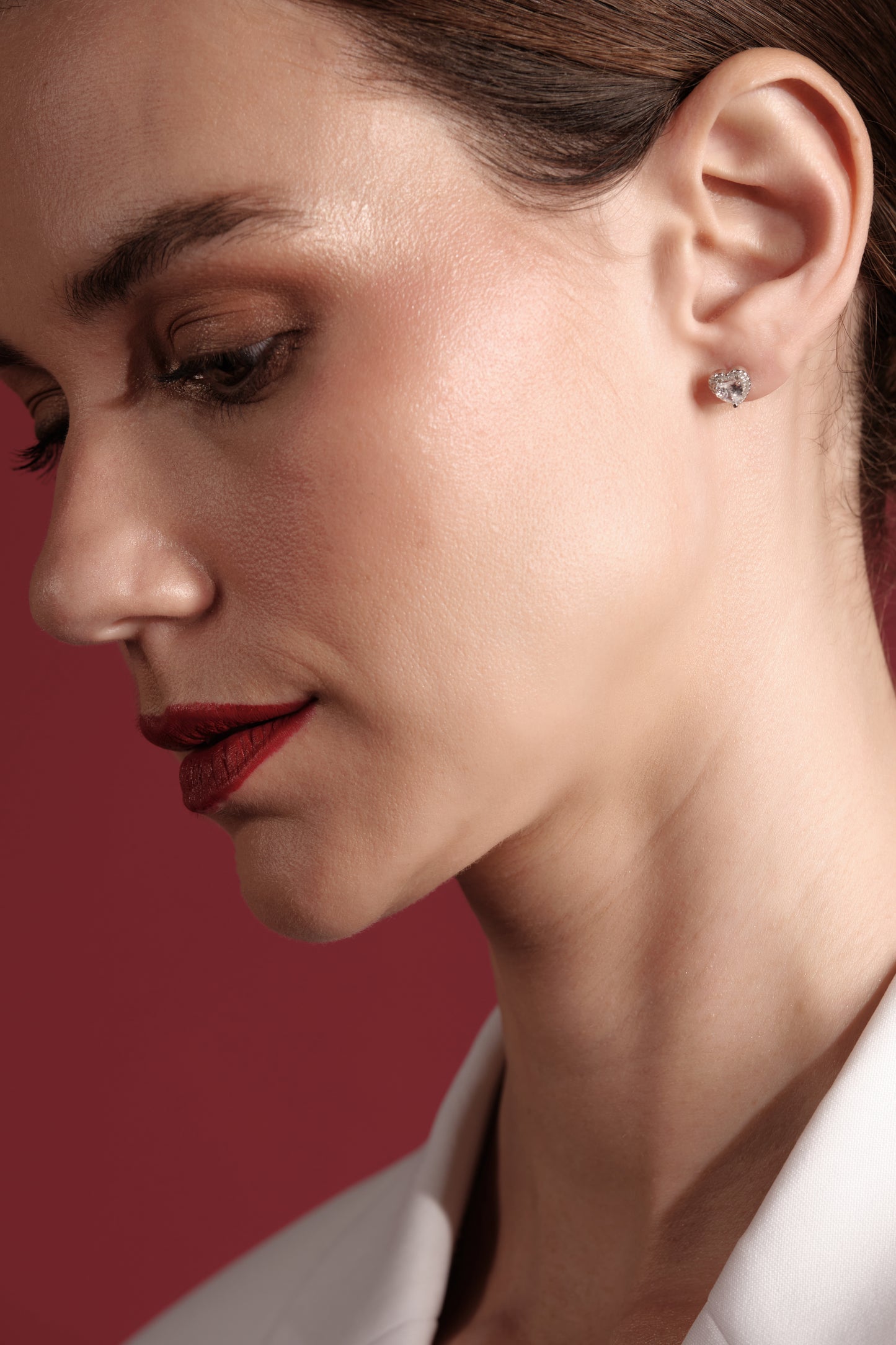Model wearing La Petite Coeur — elegant 925 sterling silver heart CZ studs for Valentine’s, weddings and everyday wear