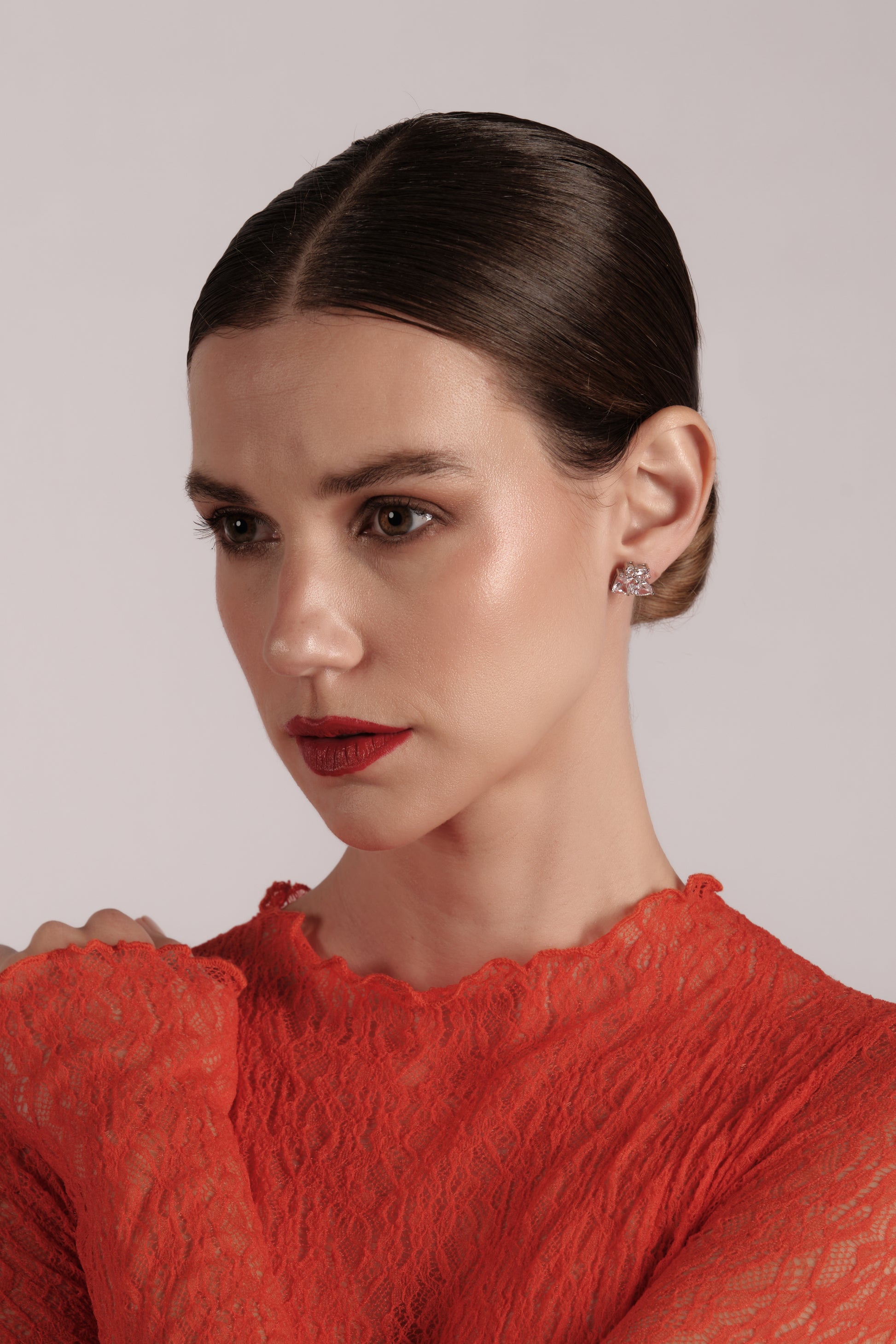 Model wearing Atelier Geo Studs — sculptural 925 sterling silver stone studs for everyday and special occasion.