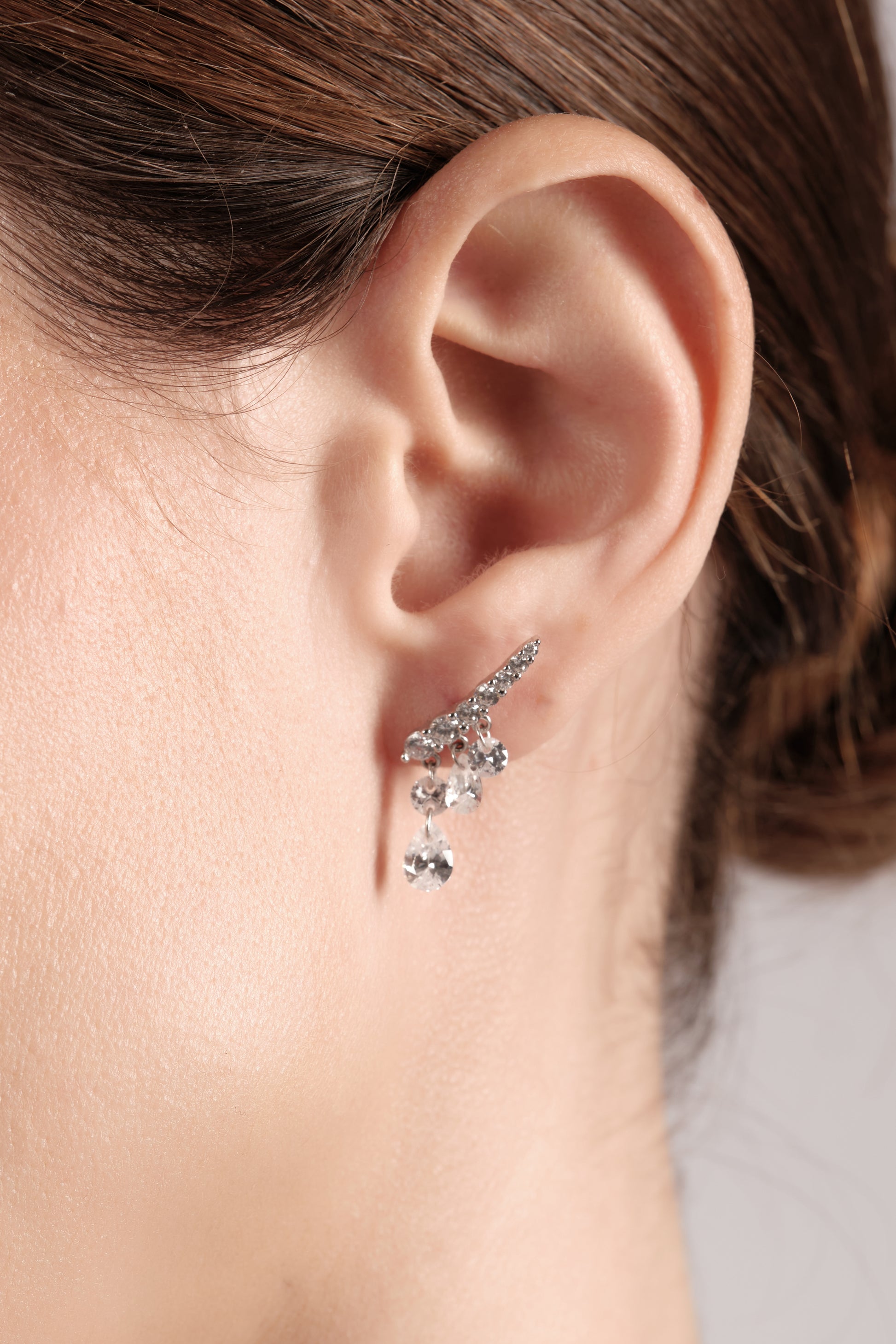 Close-up of Crystal Tear 925 sterling silver drop earrings with pavé cubic zirconia and pear teardrop drops