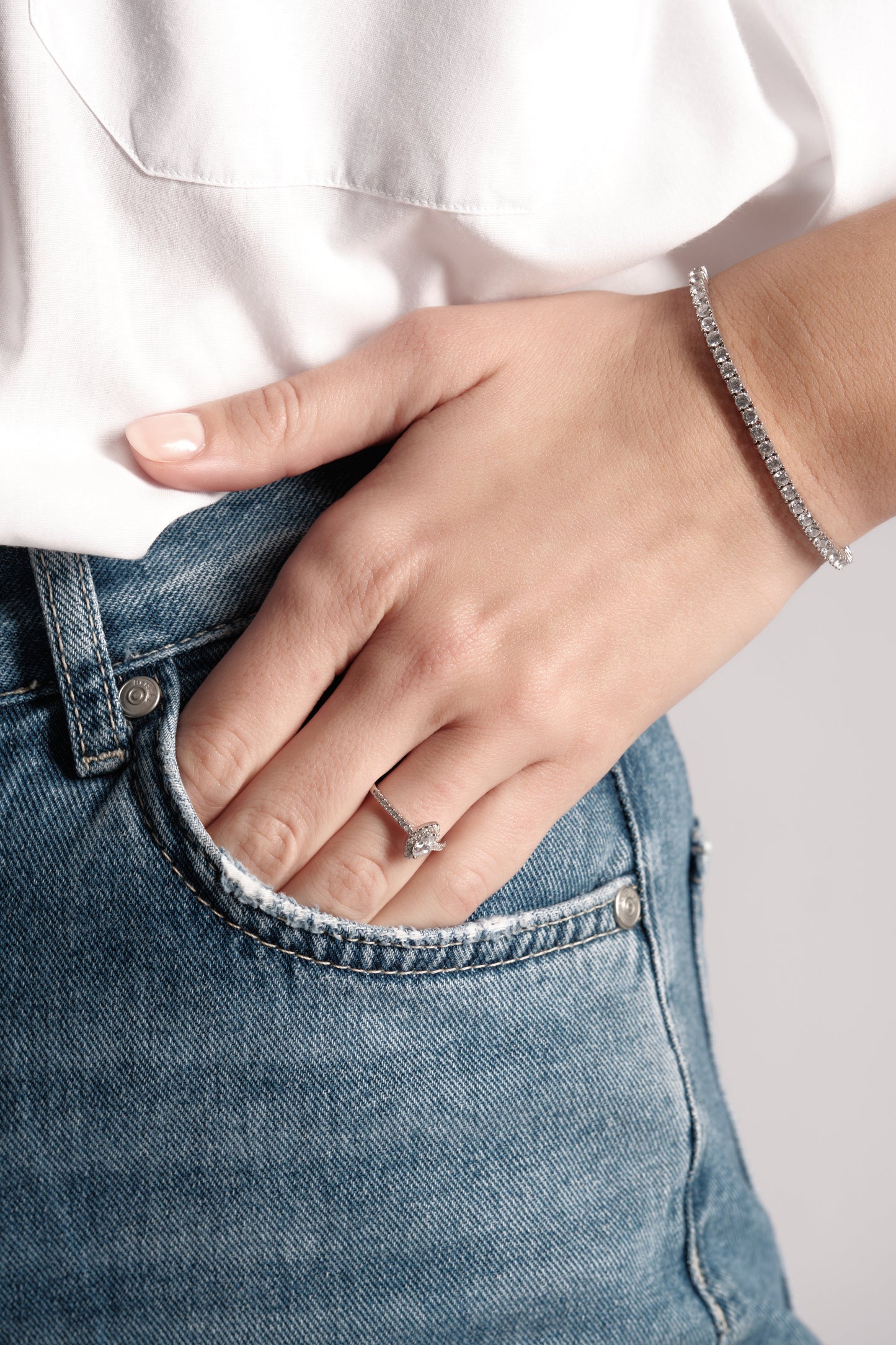 Close-up of Heritage Row 19cm tennis bracelet with 2mm cubic zirconia on model wrist