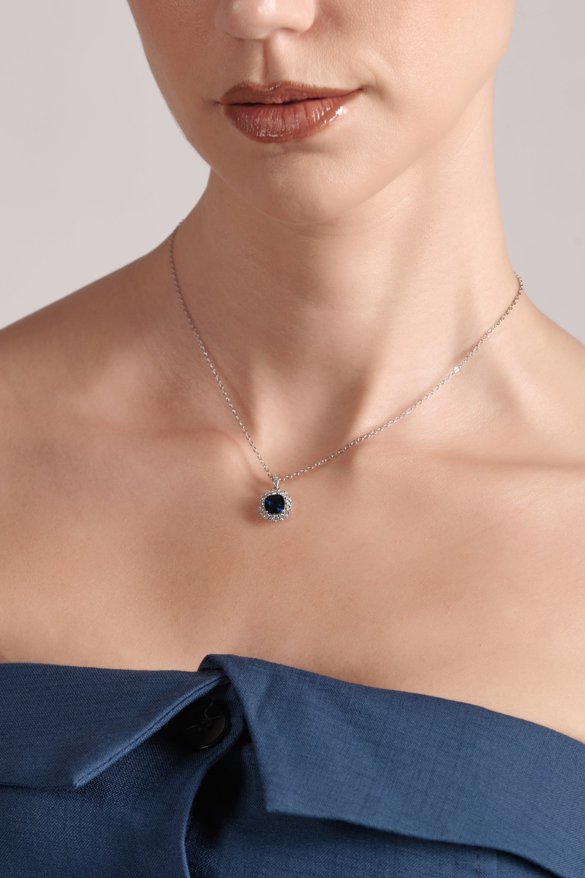 Close‑up of Mare Blu 45cm 925 sterling silver necklace with blue center stone and pavé zircon halo