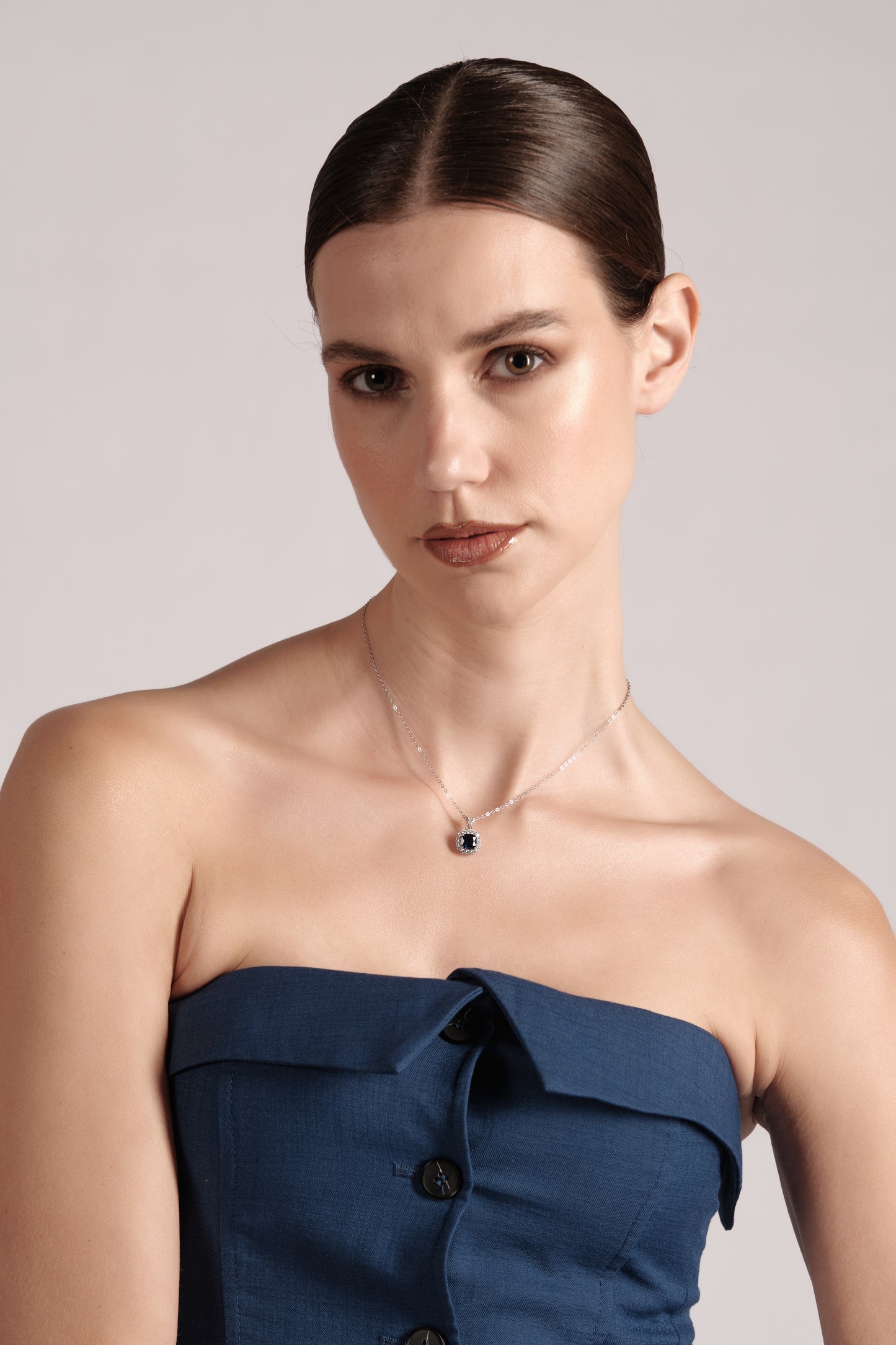 Model wearing Mare Blu 45cm sterling silver necklace — elegant blue pendant styling